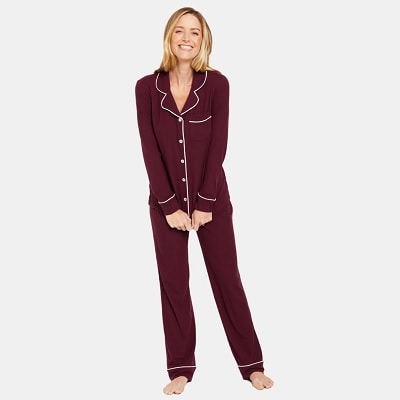 a woman wearing maroon maternity pajamas