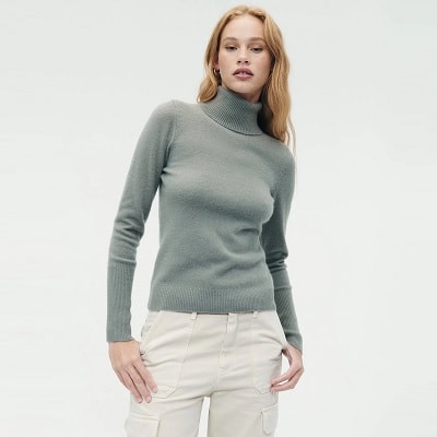 Green cashmere with ribbing at the neck, hem, and cuffs