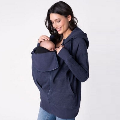 A woman carrying her baby with a 3-in-1 Maternity Hoodie