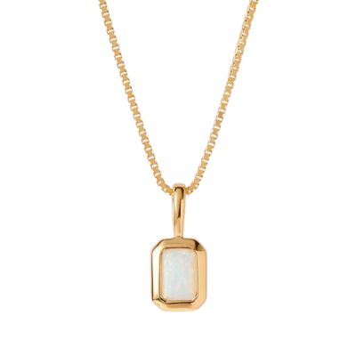 A gold chain with gold pendant. The rectangular pendant holds a white opal.