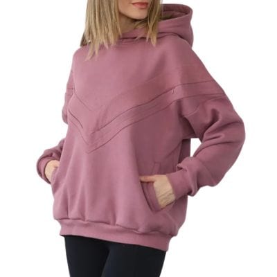 A woman wearing a dark pink nursing/maternity hoodie and black leggings