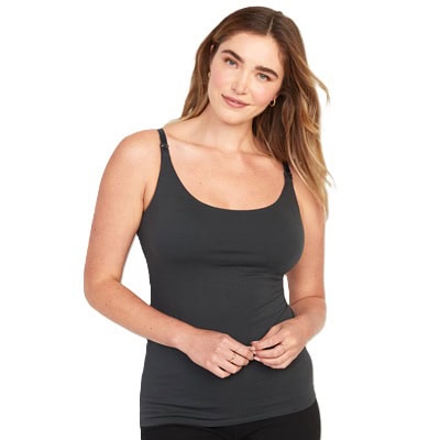 A woman wearing black leggings and a dark gray nursing camisole