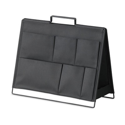 A black standing desk organizer with several pockets on each side