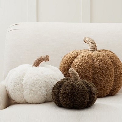 White and brown pumpkin pillows