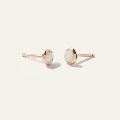 A pair of gold opal earrings