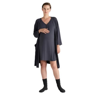 A pregnant woman wearing a set containing a gray nightgown, robe, and socks
