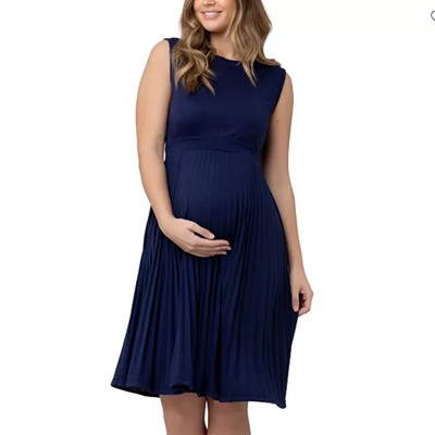 A pregnant woman wearing a navy blue dress