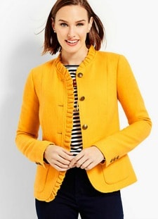 A woman wearing a Ruffle-Trim Shetland Herringbone Jacket