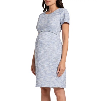 A pregnant woman wearing a light-blue maternity tweed dress