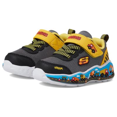 A pair of kids' sneakers with a construction vehicle design