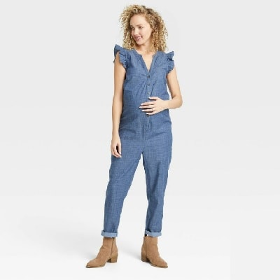 A pregnant lady wearing a lightweight, stretch chambray fabric jumpsuit