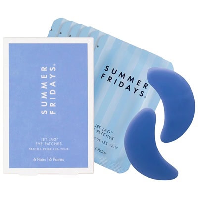 A blue package of Summer Fridays eye patches next to two of the blue eye patches