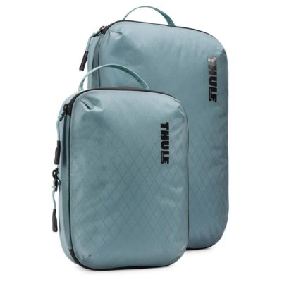 Two light blue packing cubes