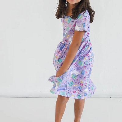 A girl wearing a travel play dress