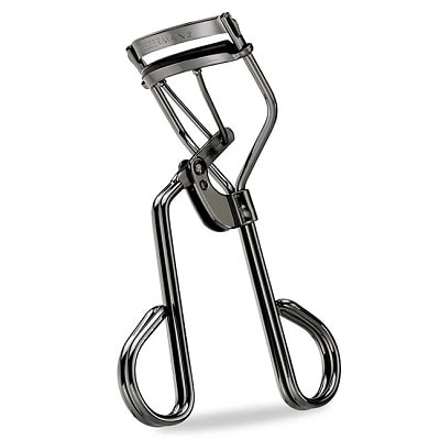 A metal lash curler on a white background
