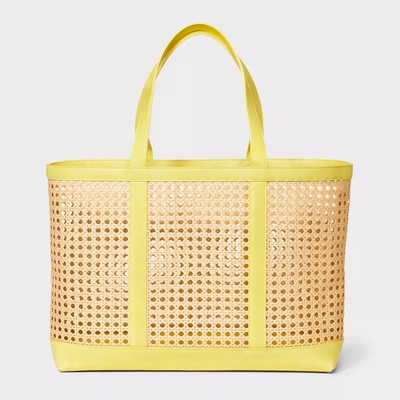 A woven tote bag with yellow trim