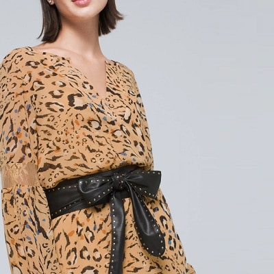 Woman wearing brown animal print top with soft studded obi belt