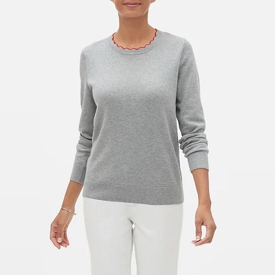 A woman wearing a Forever Scallop Crew-Neck Sweater