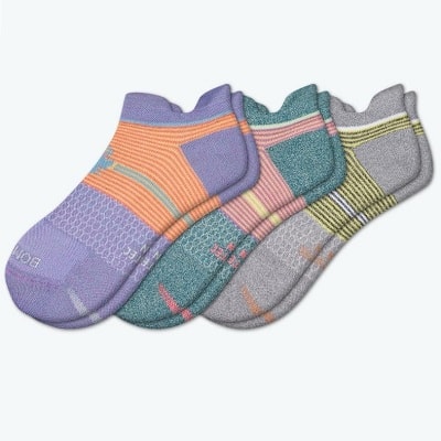 Three multicolored pairs of running socks