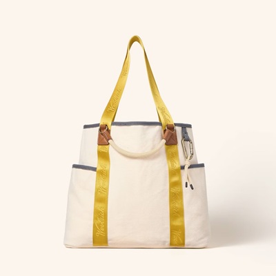A yellow and beige tote bag