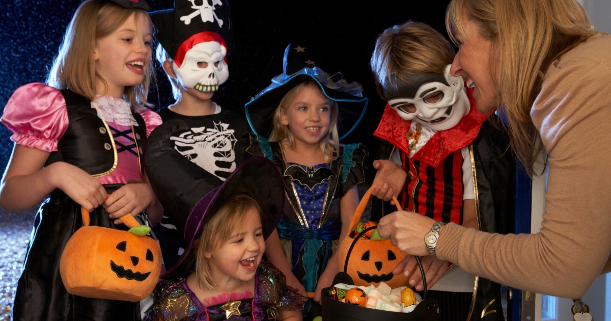 A group of kids on a costume for Halloween.