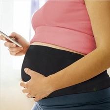 A woman wearing an Anti-Radiation Pregnancy Belly Band