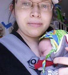 A woman holding a baby