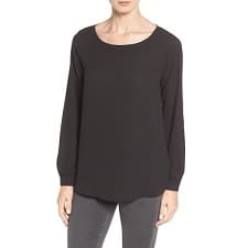 A woman wearing a Port Authority Ladies LK5600 Luxe Knit Jewel Neck Top