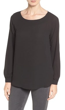 A woman wearing a Port Authority Ladies LK5600 Luxe Knit Jewel Neck Top