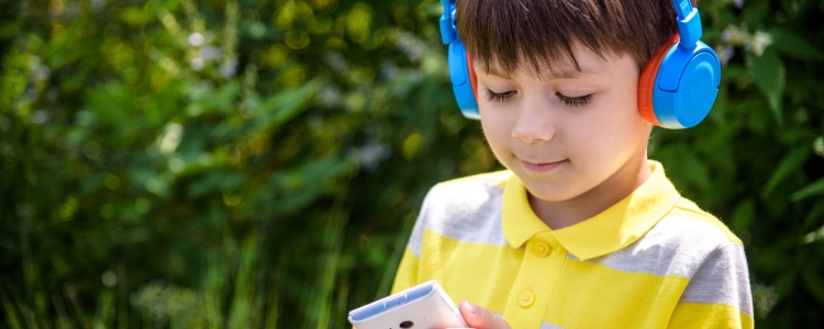 A child listening to an audiobook