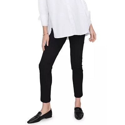 woman wears black cigarette maternity pants with a white blouse and black loafers