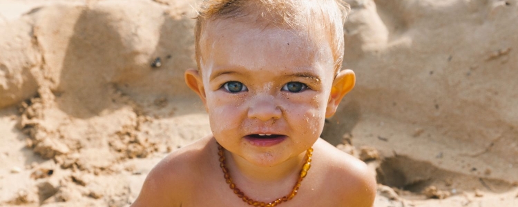 A young boy on a sandy beach