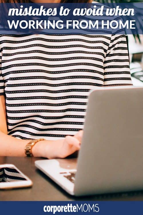 A person sitting at a table using a laptop computer