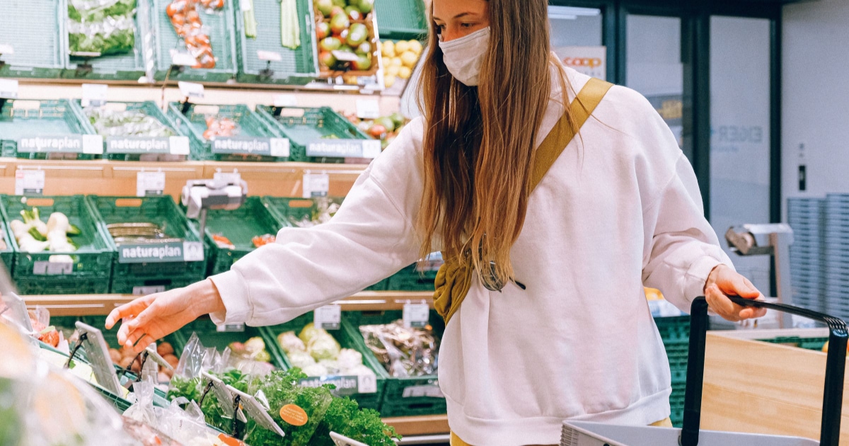 A woman selecting groceries