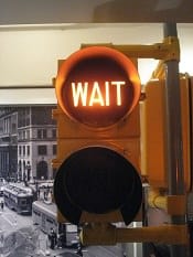 A traffic sign showing WAIT