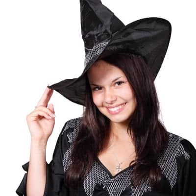 A woman wearing a Halloween witch costume