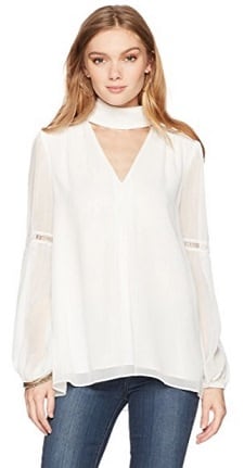 A woman wearing a white blouse