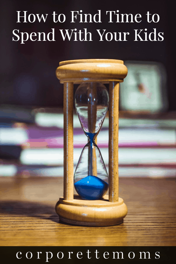 An hourglass with blue sands on top of a table