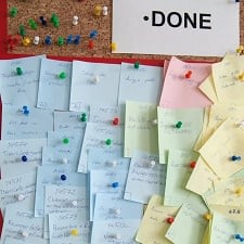 A corkboard full of sticky notes.