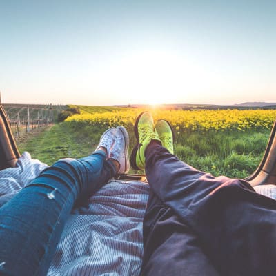 Two persons watching the sunset