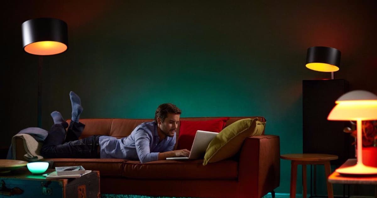 how to use smart lights for your nursery - picture of a man reading with orange light