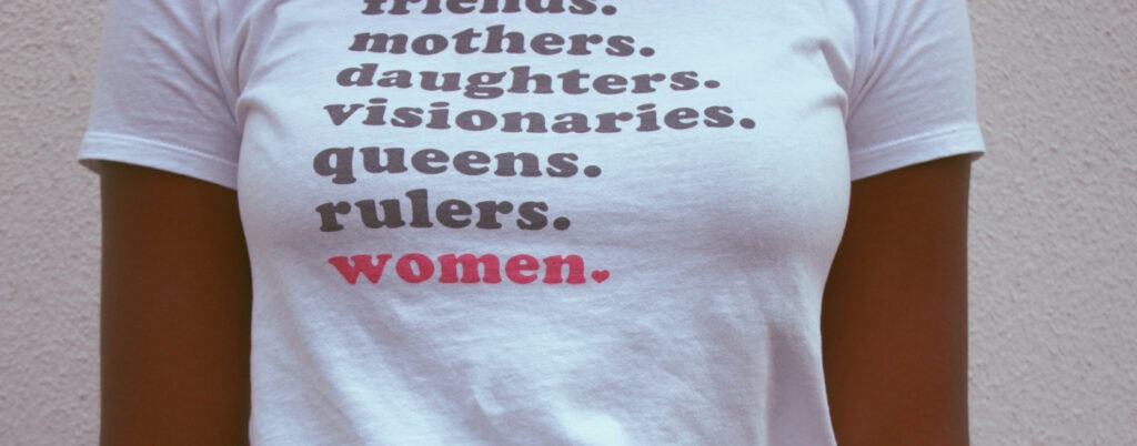 t-shirt says "mothers daughters visionaries queens rulers women."