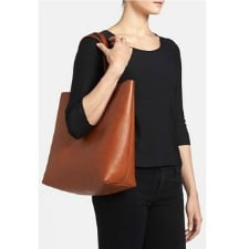 A woman wearing a Full-Grain Leather Tote Bag for Women Top handle Bag