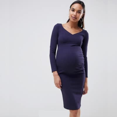 A pregnant woman wearing a V-Neck Pencil Dress