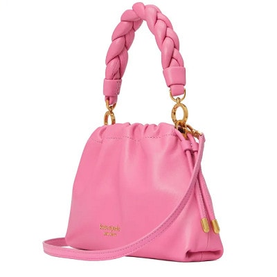 A pink crossbody bag with a braided strap