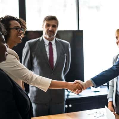 A group of people shaking hands