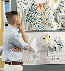Jonathan Adler choosing a wrapper design.