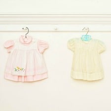 A collage of baby dresses.