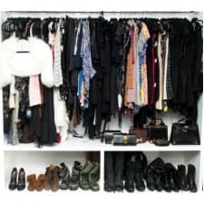 A closet full of clothes and shoes.