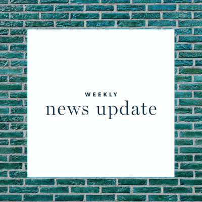 A white square with the text "weekly news update," surrounded by a border of blue bricks